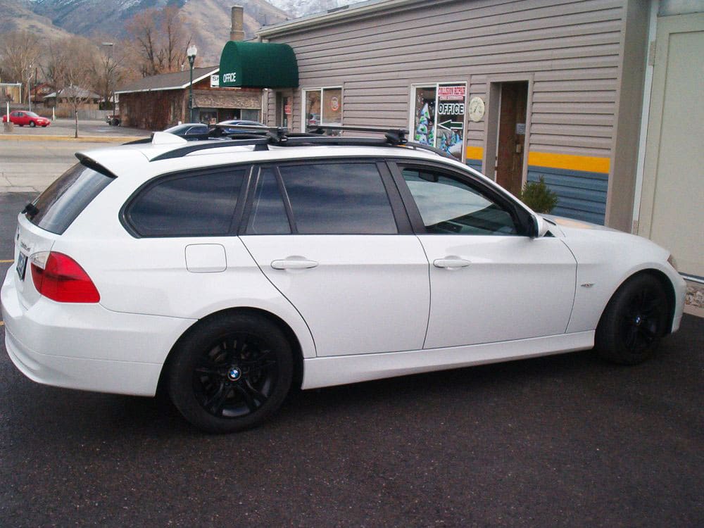 Pristine white BMW wagon after repair